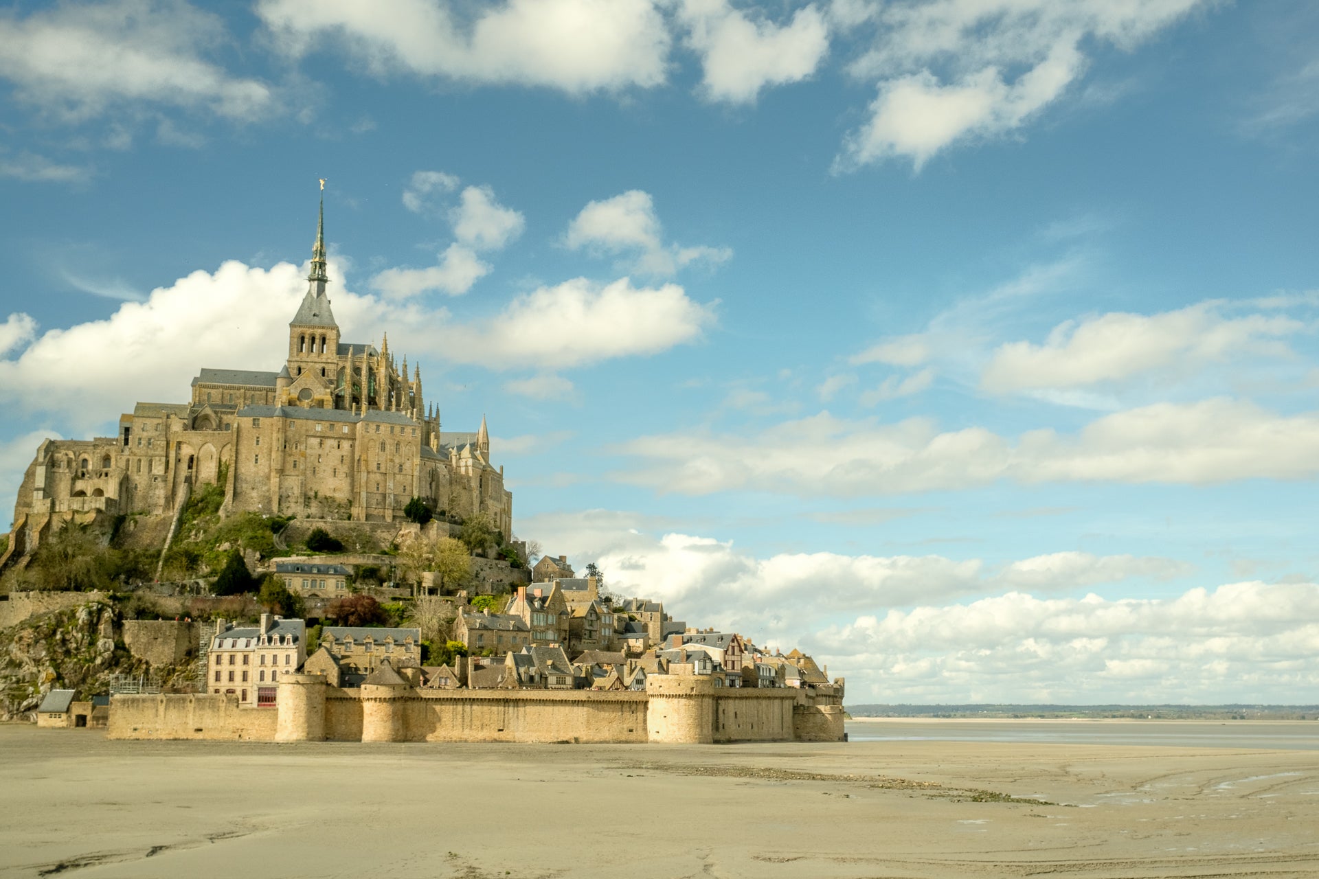 Mont Saint-Michel island with its iconic abbey on a clear day.